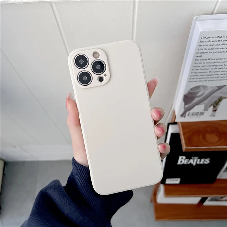 Person holding a white phone case with a blurred background