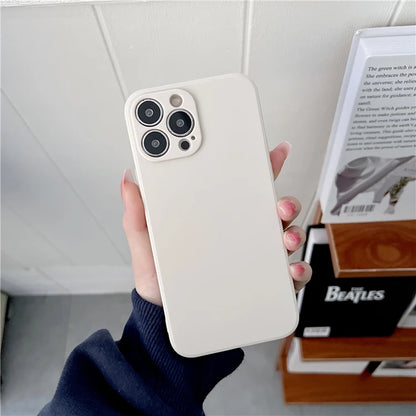 Person holding a white phone case with a blurred background